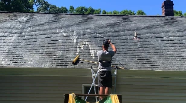 Before and after results of roof washing by Akron Power Washing in Akron